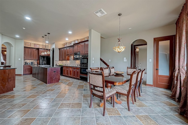 12403 Summer Lake Ranch Dr, Houston, TX 77044 - dining space with recessed lighting, arched walkways, and visible vents