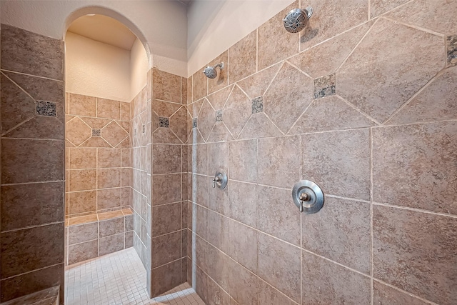 bathroom with a tile shower