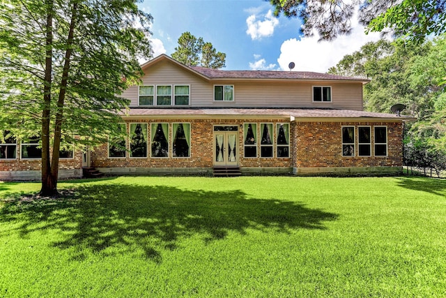 12403 Summer Lake Ranch Dr, Houston, TX 77044 - back of house with roof with shingles, french doors, entry steps, brick siding, and a yard