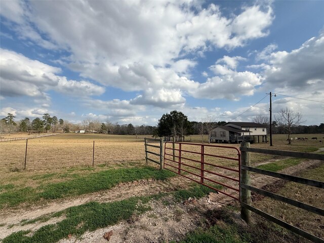 view of yard with a rural view