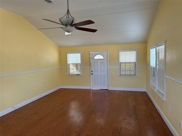 interior space featuring ceiling fan, dark hardwood / wood-style flooring, and vaulted ceiling