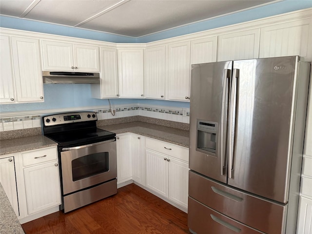 kitchen with dark hardwood / wood-style flooring, tasteful backsplash, stainless steel appliances, and white cabinets