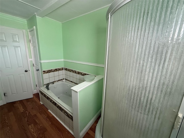 bathroom featuring hardwood / wood-style flooring and shower with separate bathtub