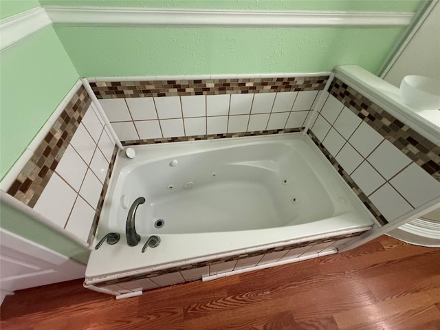 bathroom with tiled bath