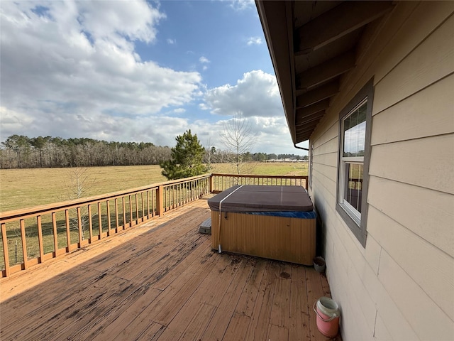 deck featuring a rural view and a hot tub