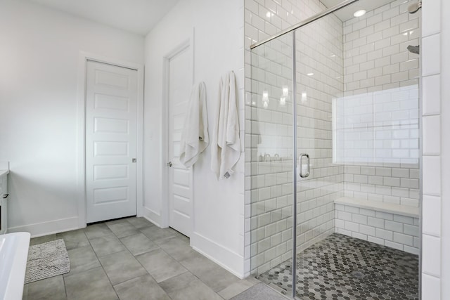 bathroom with a shower with door