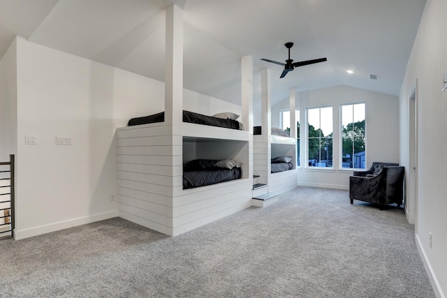 carpeted living room featuring vaulted ceiling and ceiling fan