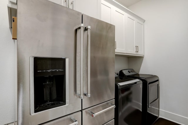 laundry area with cabinets and separate washer and dryer