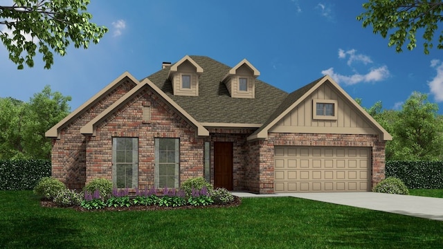 view of front of house with a garage and a front lawn