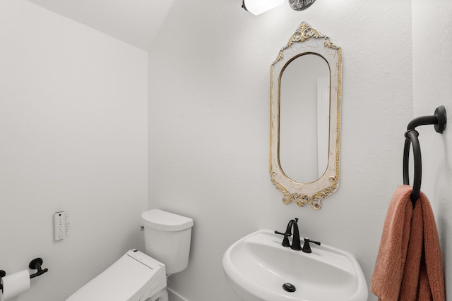 bathroom featuring sink and toilet