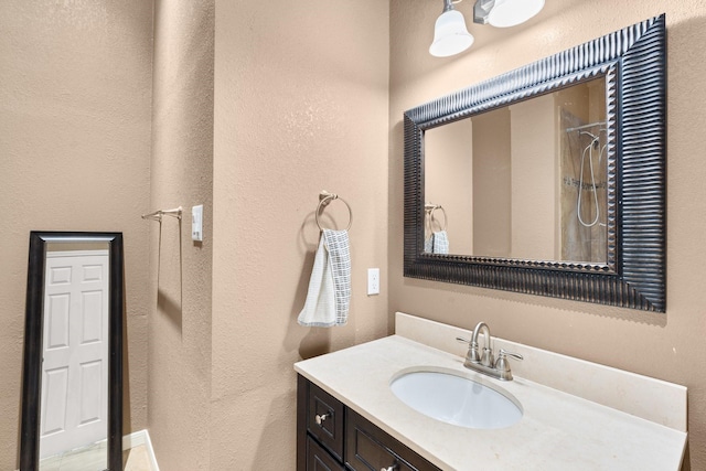 bathroom with vanity and walk in shower