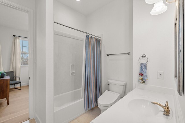 full bathroom with tile patterned flooring, sink, toilet, and shower / bath combo