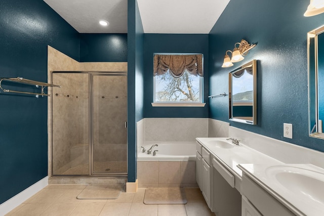 bathroom featuring tile patterned floors, separate shower and tub, and vanity