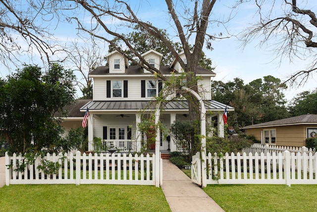 view of front of property featuring a front yard and a porch