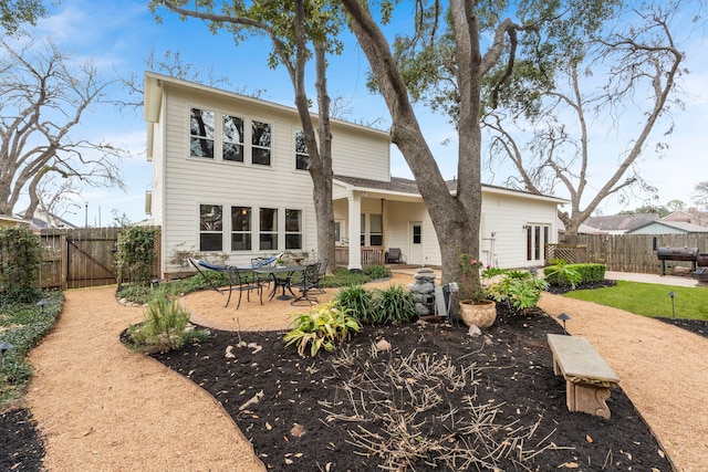 rear view of property featuring a patio