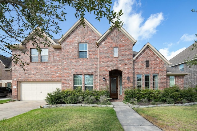 front of property featuring a garage and a front lawn