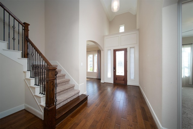 foyer featuring high vaulted ceiling and dark hardwood / wood-style floors