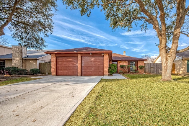 ranch-style house with a garage and a front yard