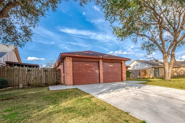 garage featuring a yard