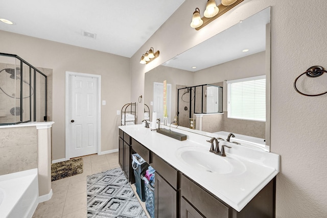 bathroom featuring vanity, separate shower and tub, and tile patterned floors