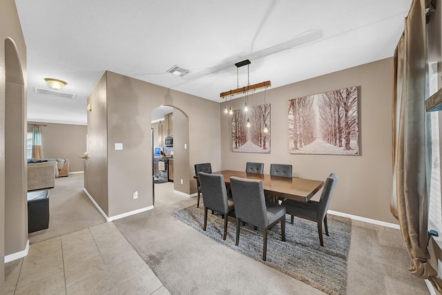 view of carpeted dining space