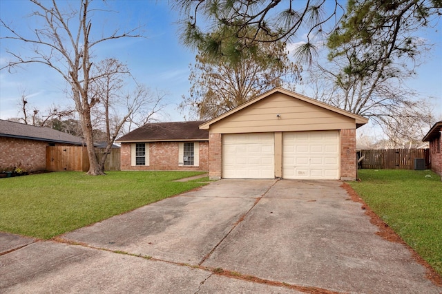 ranch-style house with a garage and a front yard