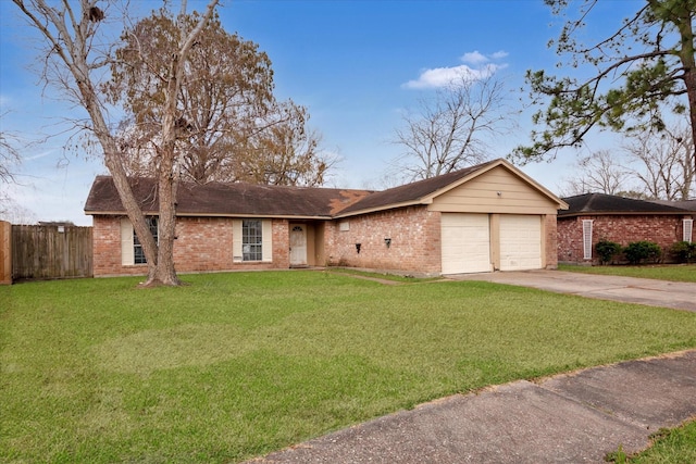 ranch-style home with a garage and a front yard