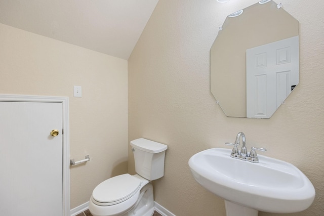 bathroom featuring sink and toilet