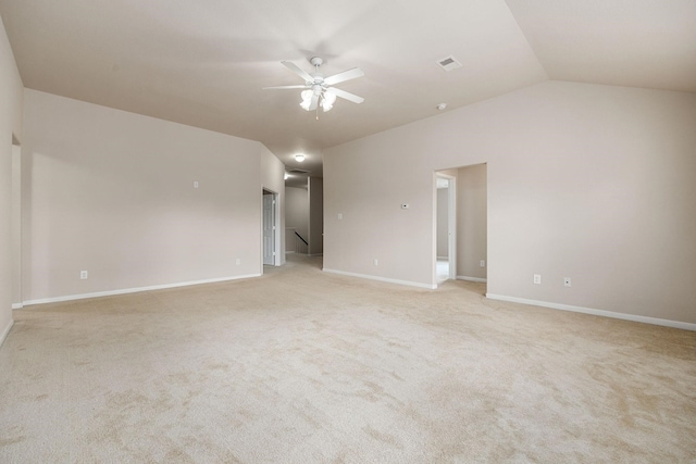 carpeted spare room with lofted ceiling and ceiling fan