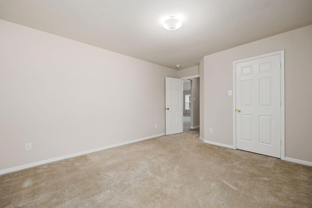 unfurnished bedroom with light carpet