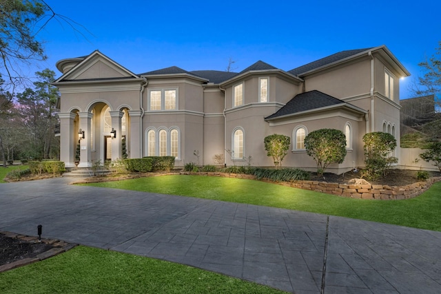 view of front of home with a yard