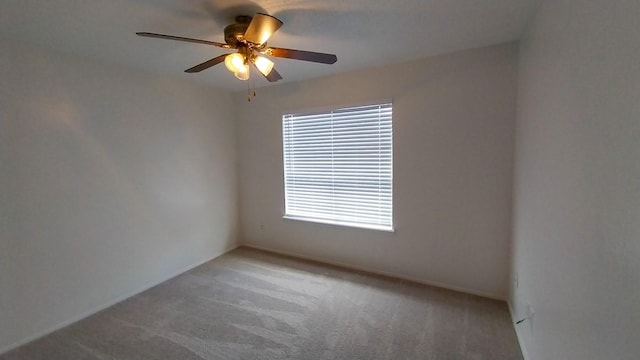 carpeted empty room with ceiling fan