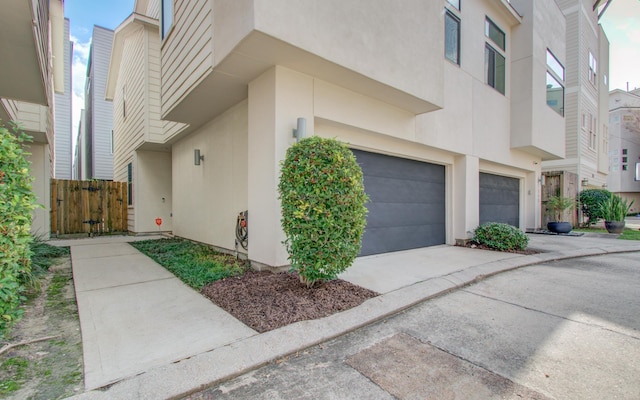 view of side of property with a garage