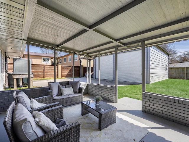 view of patio featuring outdoor lounge area and fence private yard