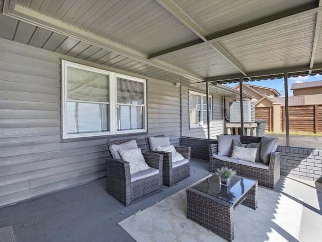 view of patio / terrace with fence and an outdoor hangout area