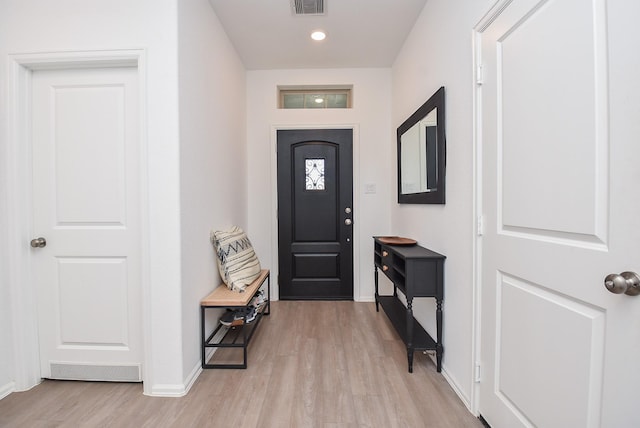 foyer with light hardwood / wood-style floors