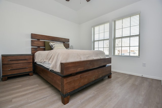 bedroom featuring light hardwood / wood-style floors and ceiling fan