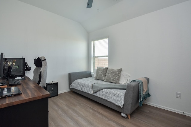 home office featuring hardwood / wood-style flooring, lofted ceiling, and ceiling fan