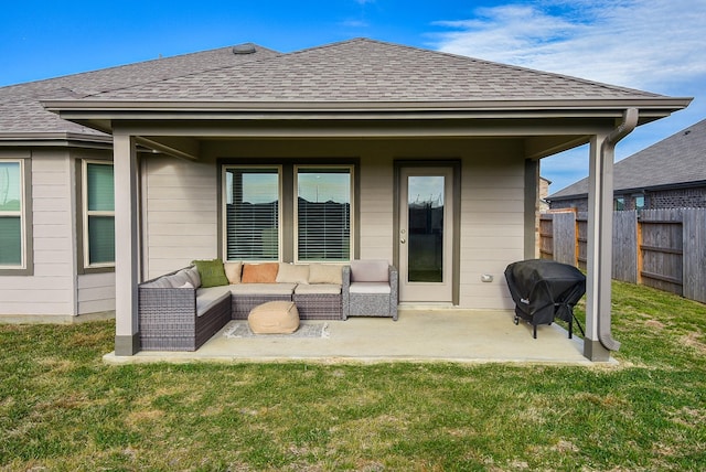 rear view of house featuring a patio, outdoor lounge area, and a yard