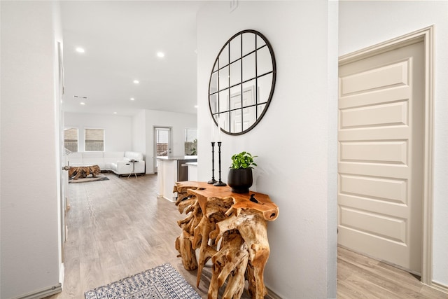 corridor featuring light wood-style floors and recessed lighting