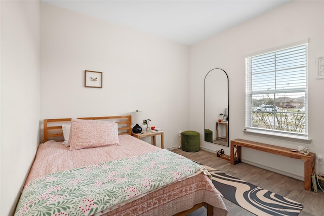 bedroom with wood finished floors