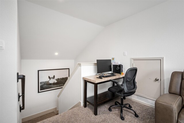 office area with lofted ceiling and carpet floors