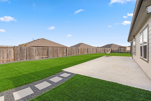 view of yard with a patio and a fenced backyard