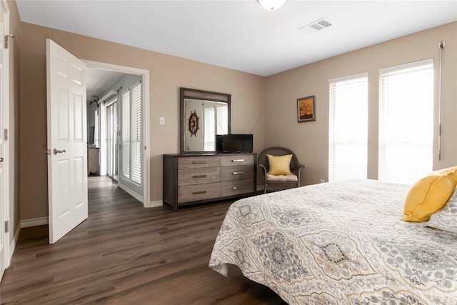 bedroom featuring dark hardwood / wood-style flooring