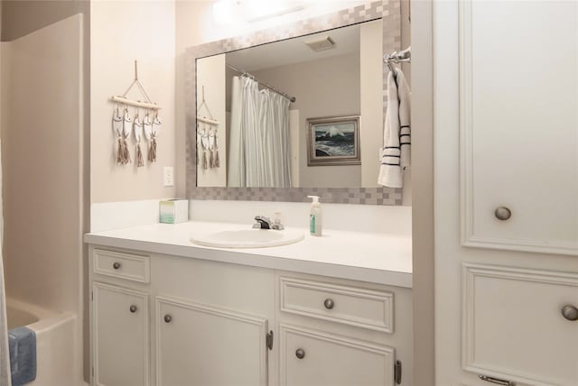 bathroom featuring vanity and shower / bath combo with shower curtain