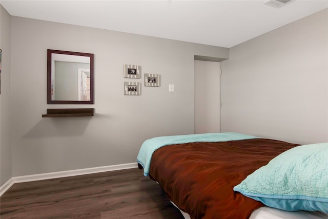 bedroom featuring dark hardwood / wood-style floors