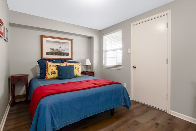 bedroom featuring dark wood-type flooring