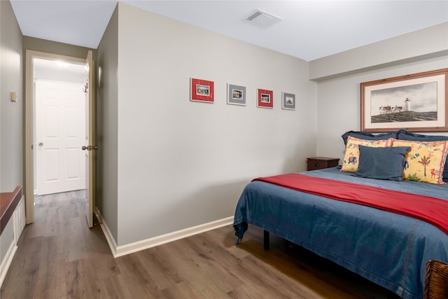 bedroom featuring dark hardwood / wood-style floors