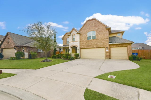 view of front of house with a garage and a front lawn