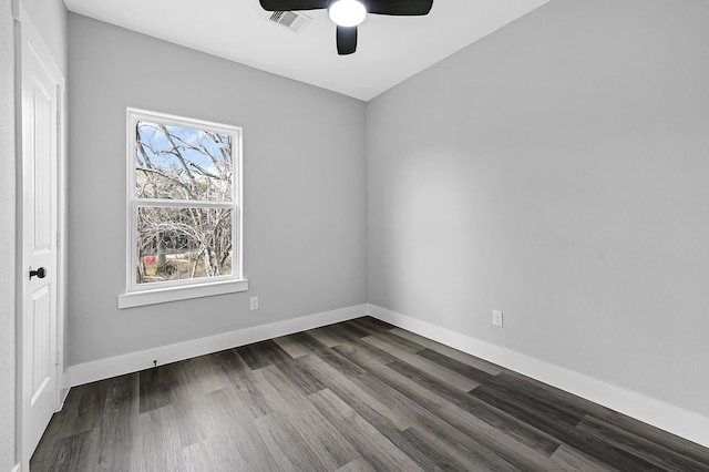 empty room with dark hardwood / wood-style floors and ceiling fan